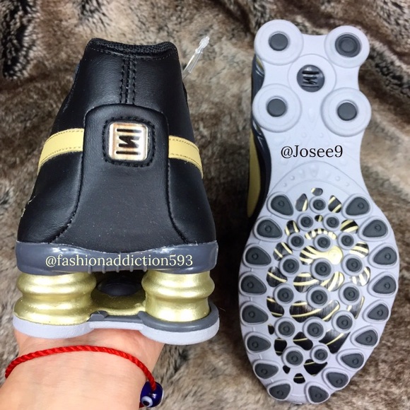 gold nike shox womens